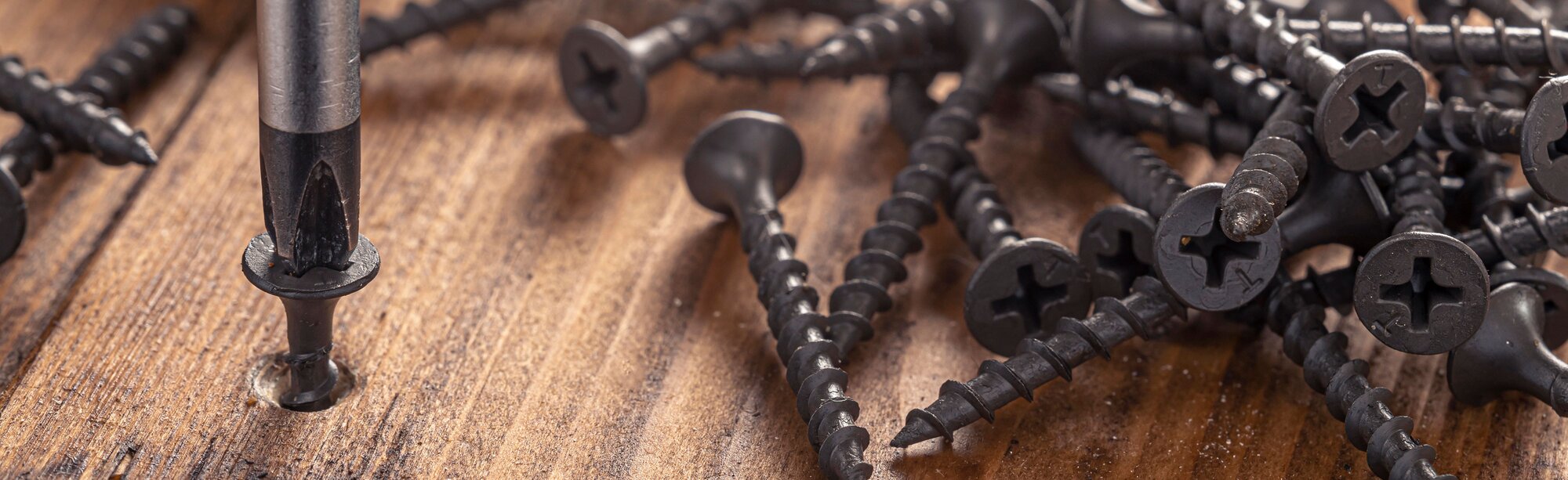 Image of a drill working on metal