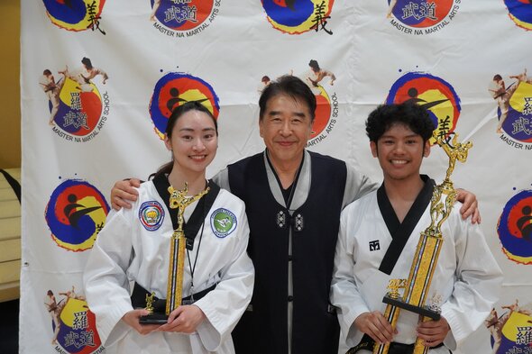 Row of beginner students practicing their punches