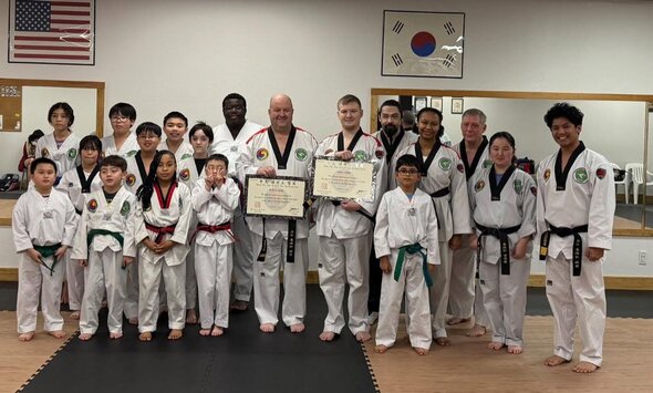Row of beginner students practicing their punches