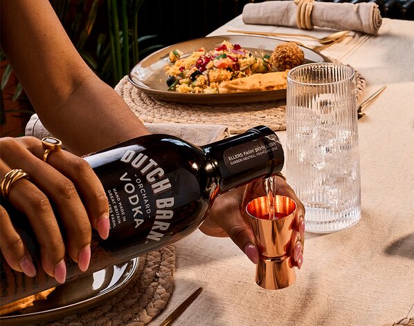 A bottle of Dutch Barn Orchard Vodka being poured