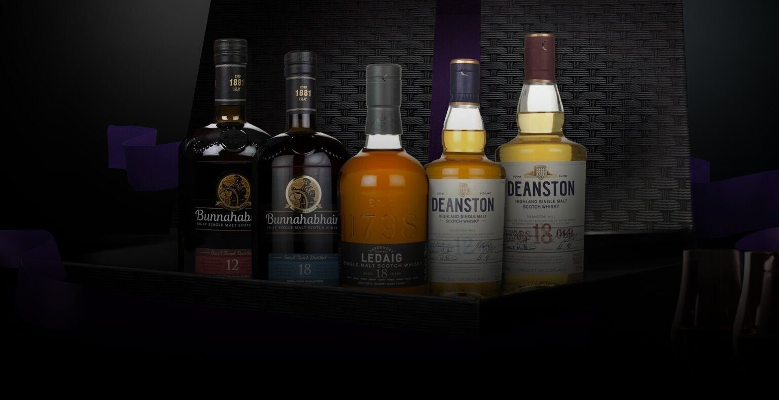Five bottles of CVH whisky in a hamper.