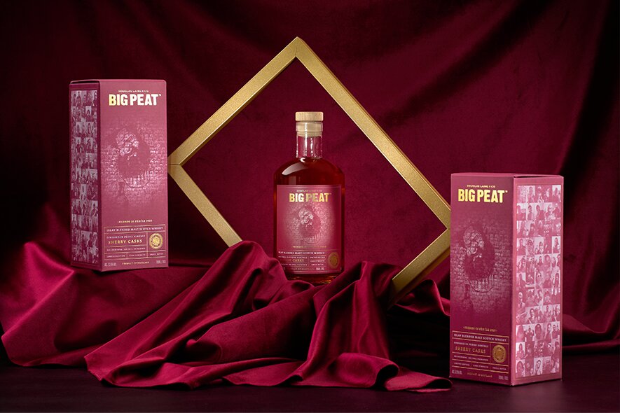 A bottle of Big Peat 2026 release in a gold frame.