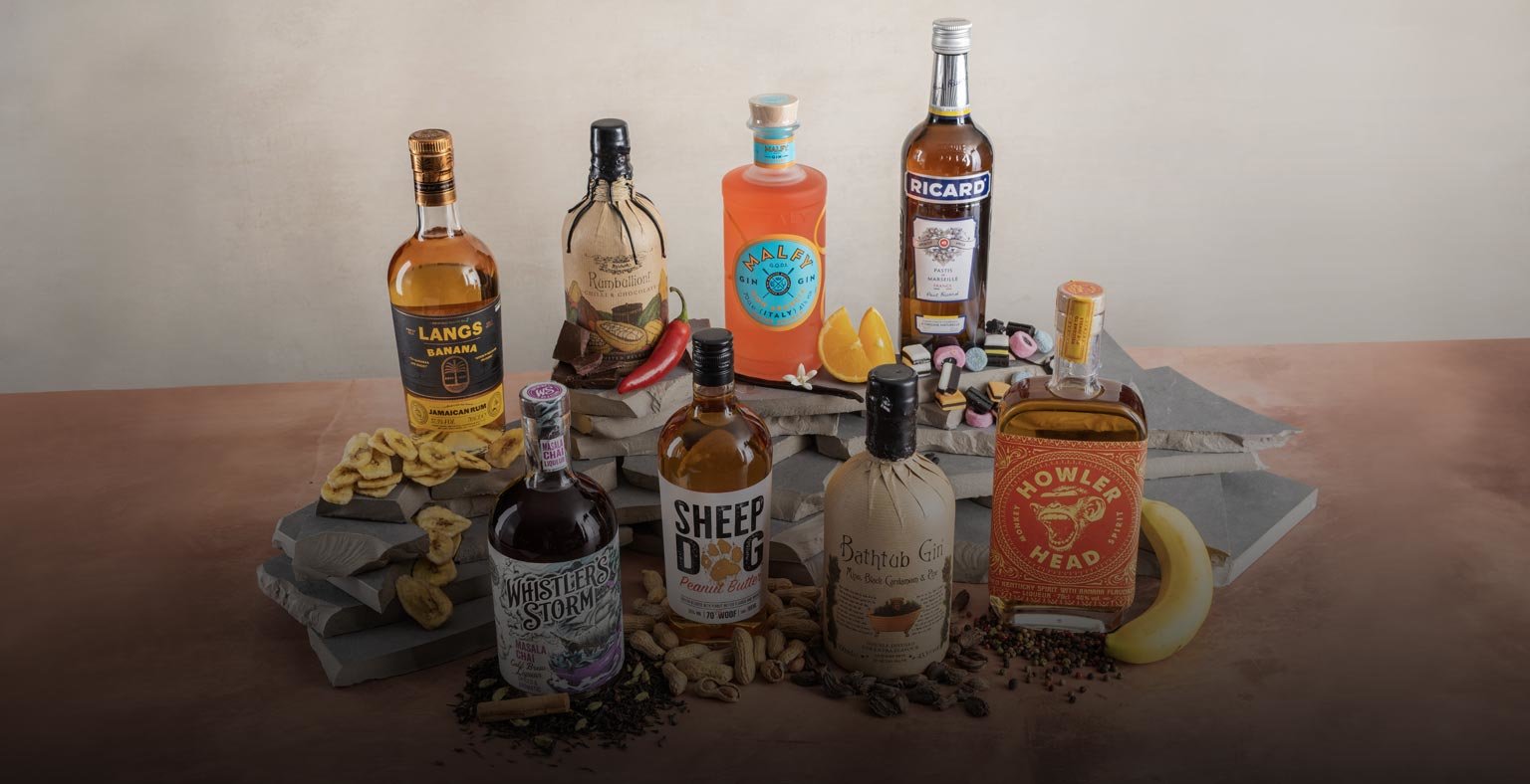 Eight bottles of flavoured spirits surrounded by their key flavour profile. 