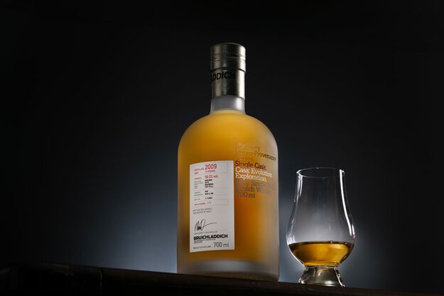 Bottle of Bruichladdich Master of Malt Exclusive with a dram