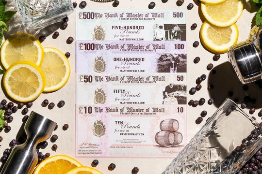 Gift vouchers scattered with gin botanicals