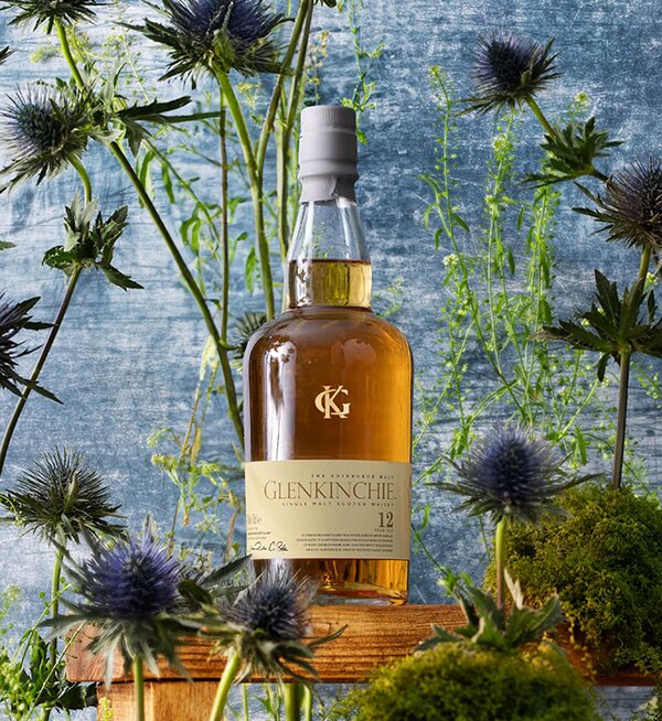 A bottle Glenkinchie 12 year old surrounded by thistles. 