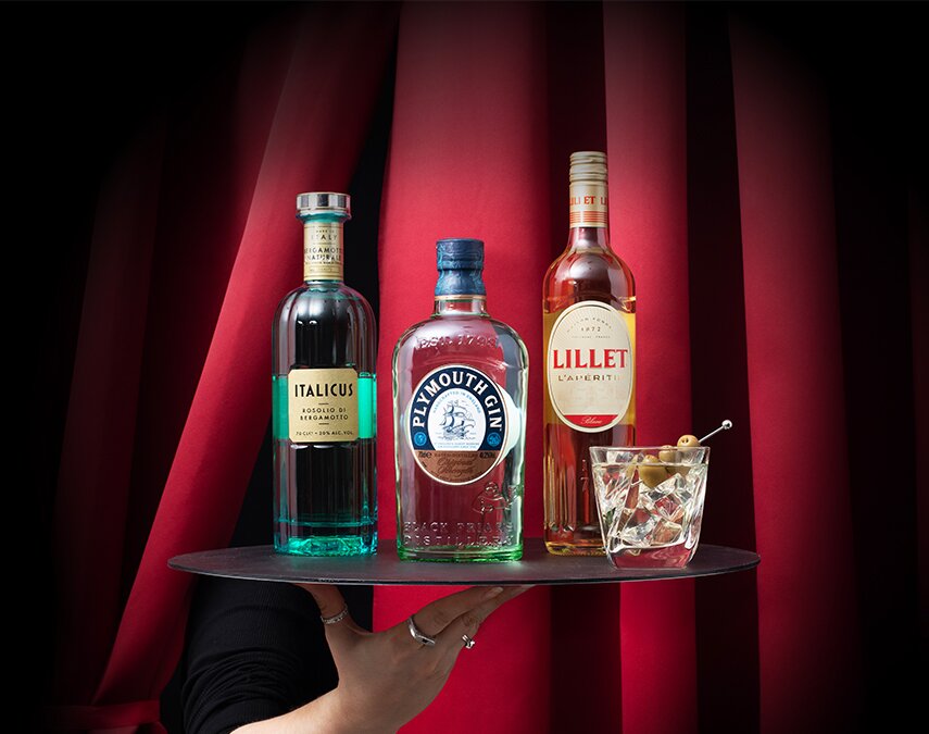 A bottle of Italicus, Plymouth Gin and Lillet Blanc with a white negroni cocktail.