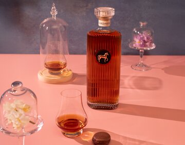 A bottle of SirDavis Whiskey.