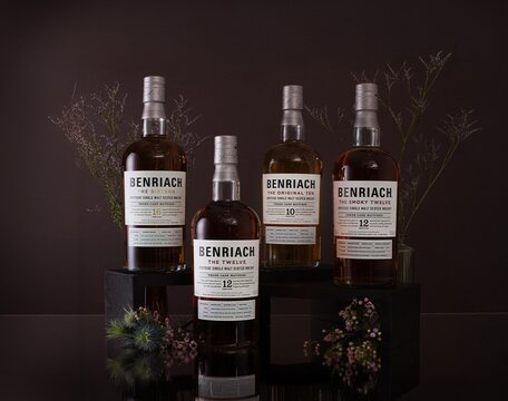 Benriach whisky bottles surrounded by thistles.