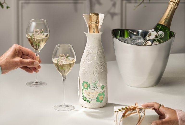 A bottle of champagne with glasses
