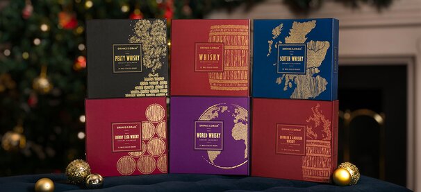 Whisky advent calendars with drams and glasses of whisky.