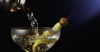 A vodka based cocktail, with olives.