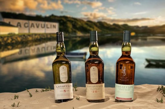 Three Lagavulin bottles Scottish background