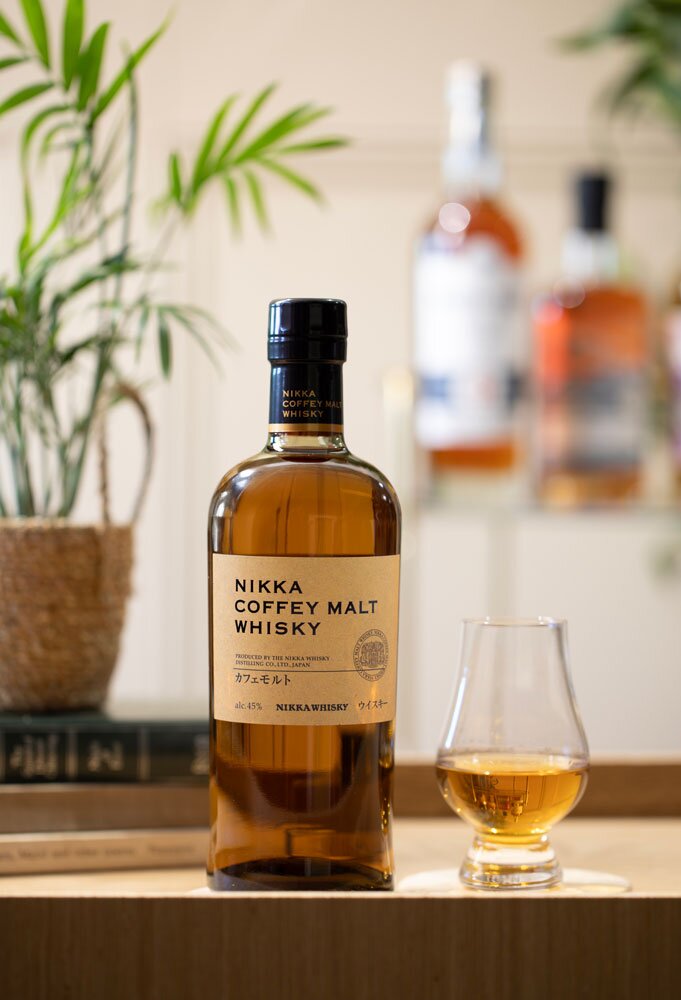 Nikka Coffey Malt whisky bottle with tasting glass