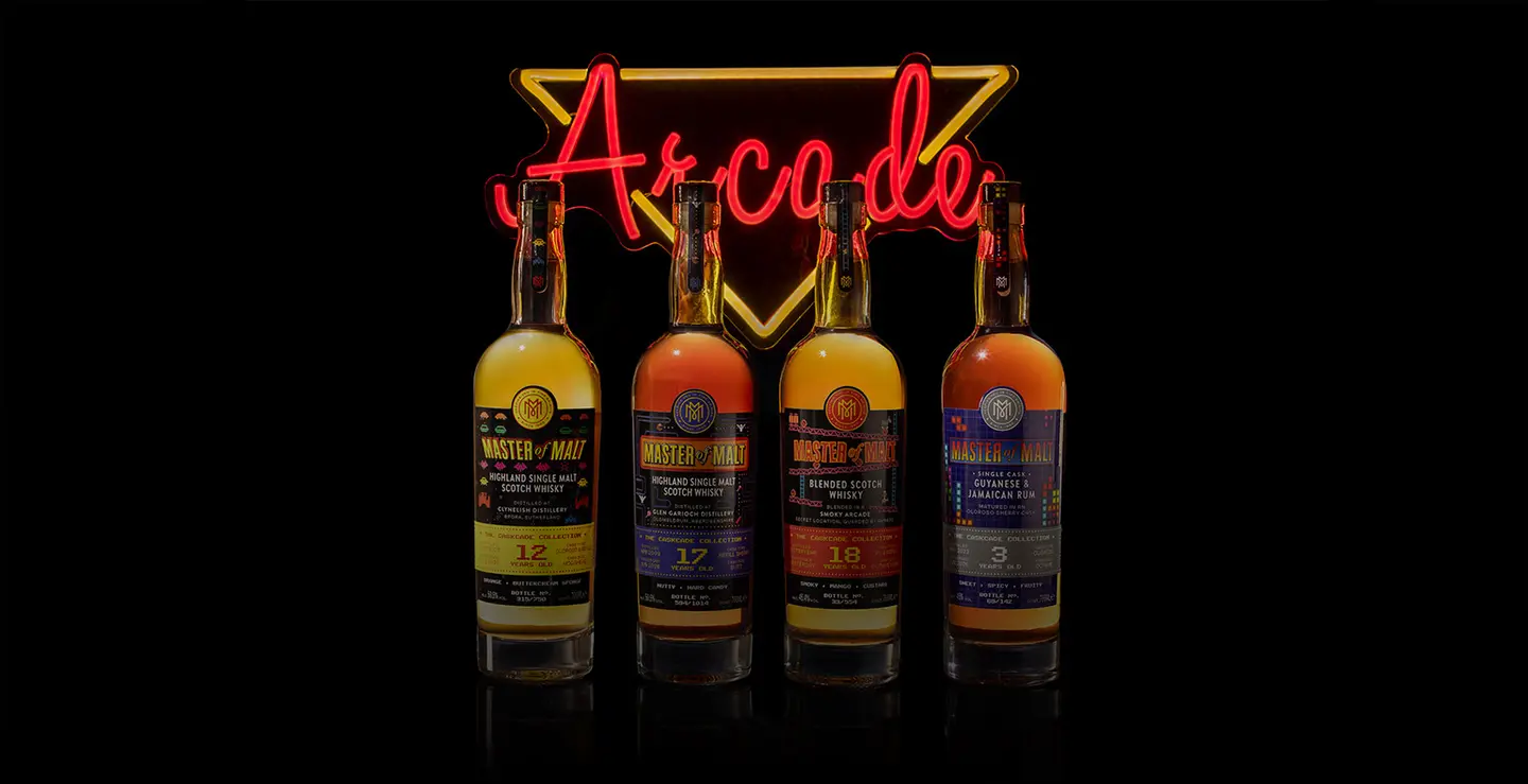 Four bottles of Caskade Whisky with a neon arcade sign.