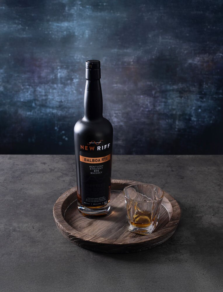 New Riff Straight Balboa Rye whiskey bottle with glass