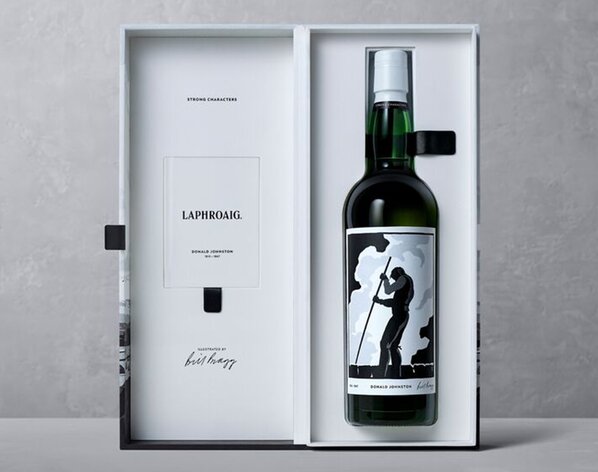 A bottle of Laphroaig 33 Year Old Strong Characters inside its open presentation box.