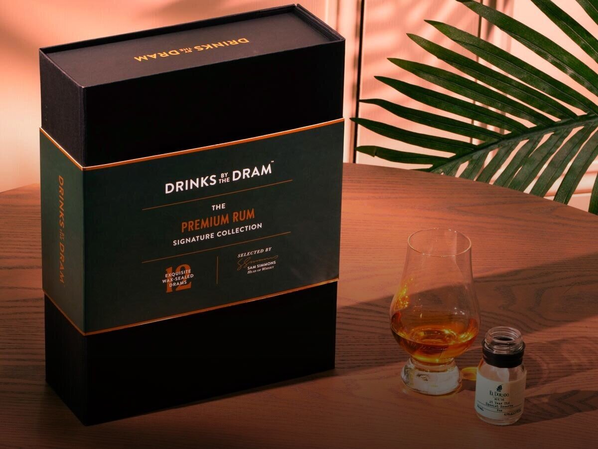 A whisky gift box and dram of whisky. 