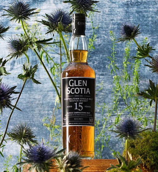A bottle of Glen Scotia 15 Year Oldsurrounded by thistles. 