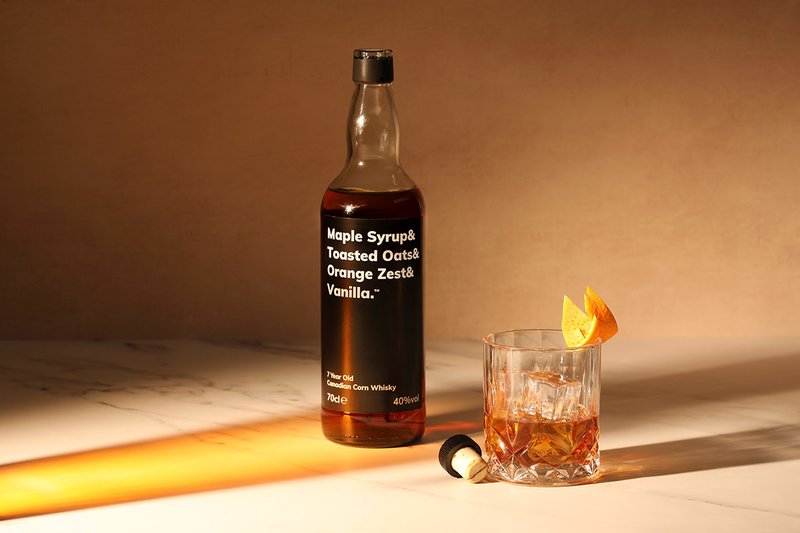 A bottle of Maple Syrup& Toasted Oats& Orange Zest& Vanilla. 
