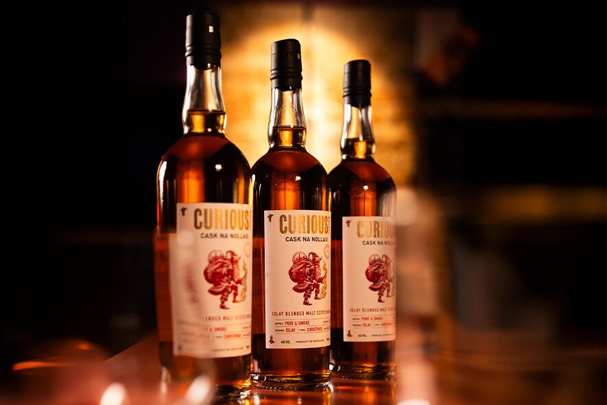 Three bottles of Cask na Nollaig Whisky.