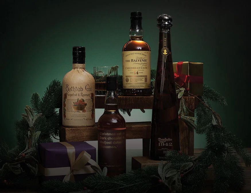 A range of bottles on a green Christmas background