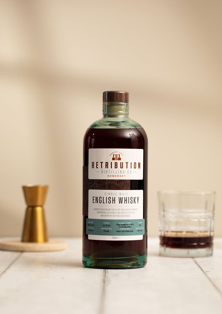 Retribution 3 Year Old (Cask PR006) Chestnut Cask whisky bottle in front of glass and jigger