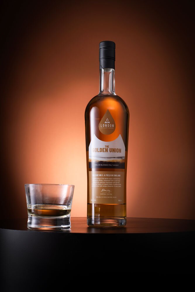 The Golden Union: Release No.1 - A Field in England whisky bottle with glass