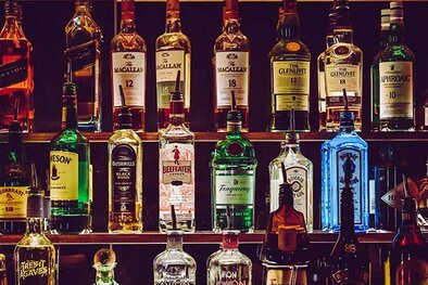 A bar with a selection of bottles