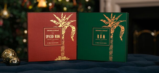 Rum advent calendars with drams and glasses of rum.