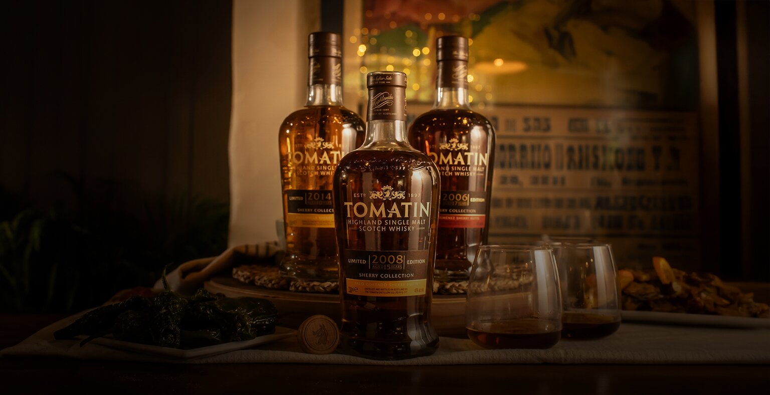 Three bottles of Tomatin whisky