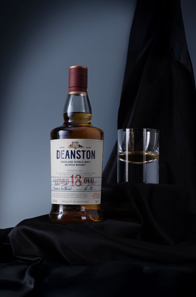 Deanston 18 Year Old whisky bottle with glass