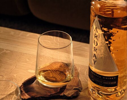 Ardray being poured over an ice cube