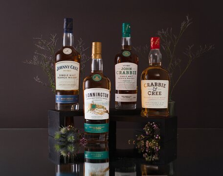 Bonnington whisky bottles surrounded by thistles