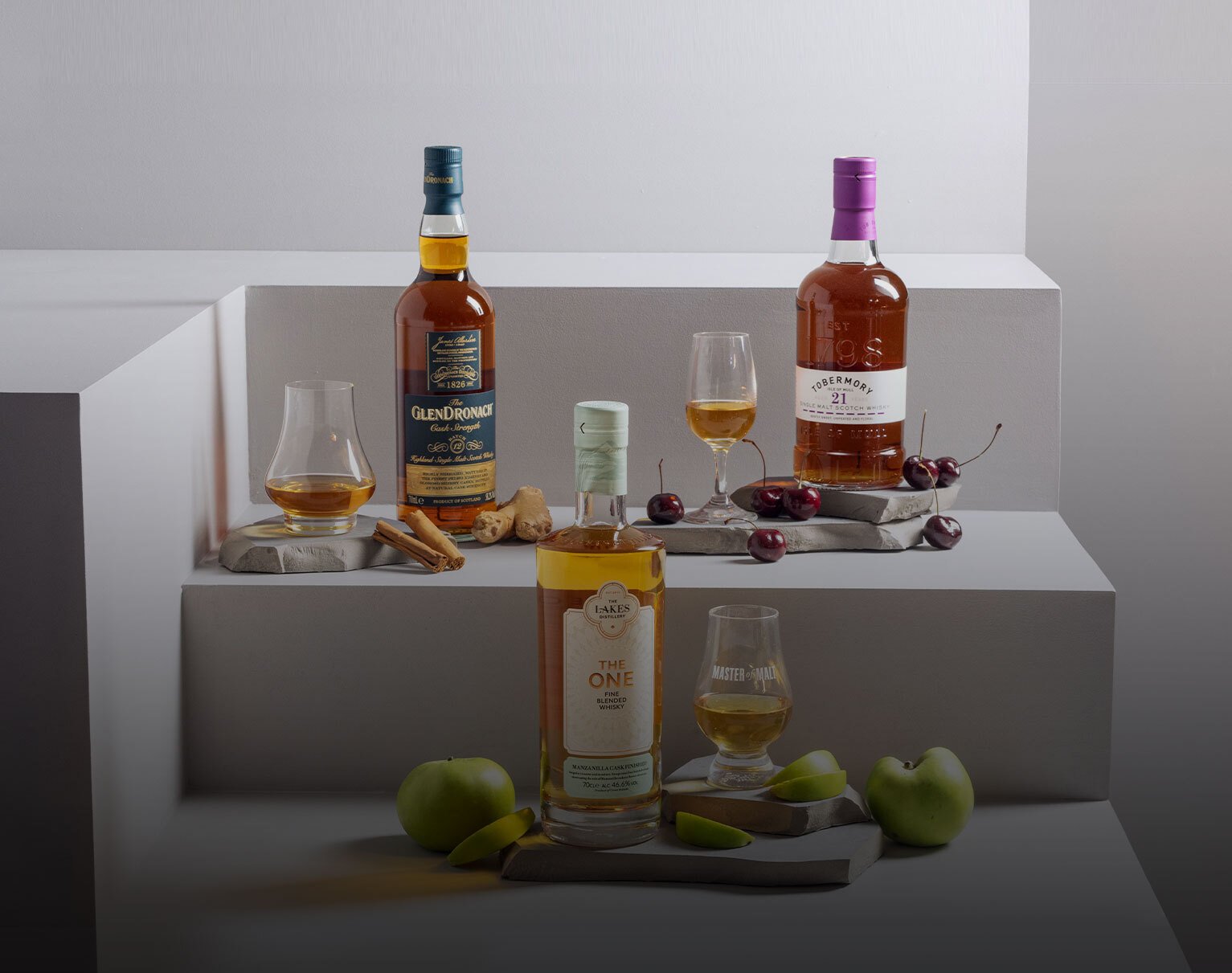 Three bottles of whisky with whisky glass and food pairing