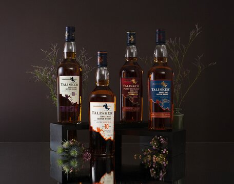 Talisker whisky bottles surrounded by thistles