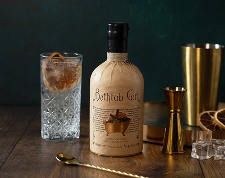 A bottle of Bathtub Gin with a Gin & Tonic. 