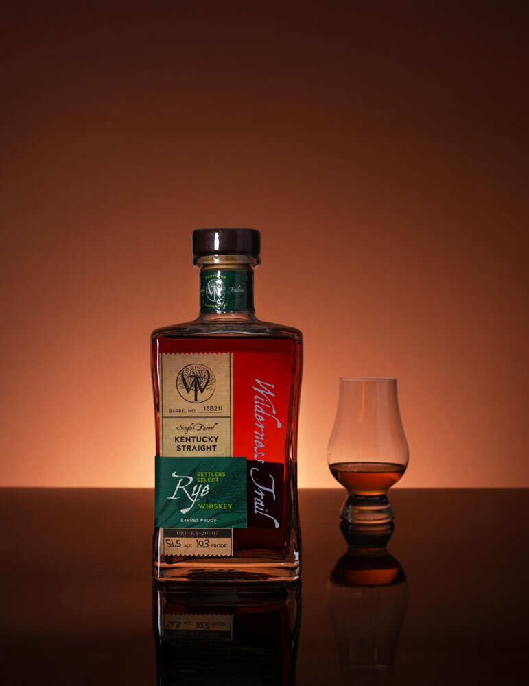 Wilderness Trail Cask Strength Rye whiskey bottle with glass