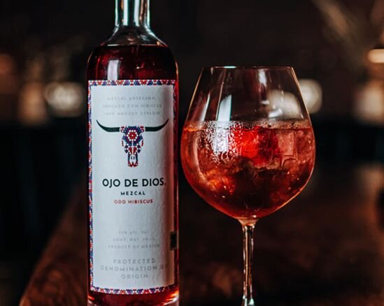 A bottle of Ojo De Dios ODD Hibiscus