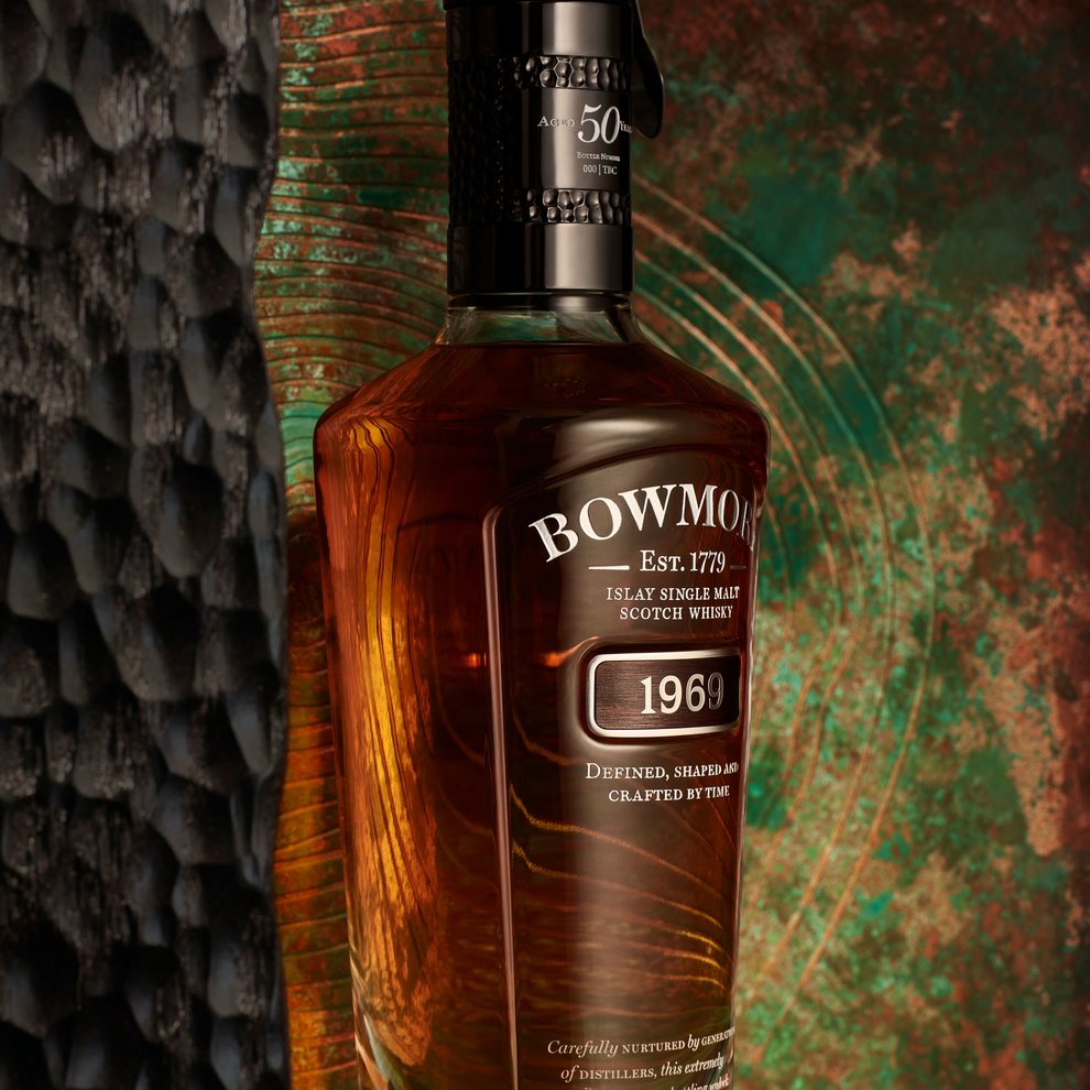 Close-up of Bowmore 1969 bottle with acid-etched copper and charred wood presentation box