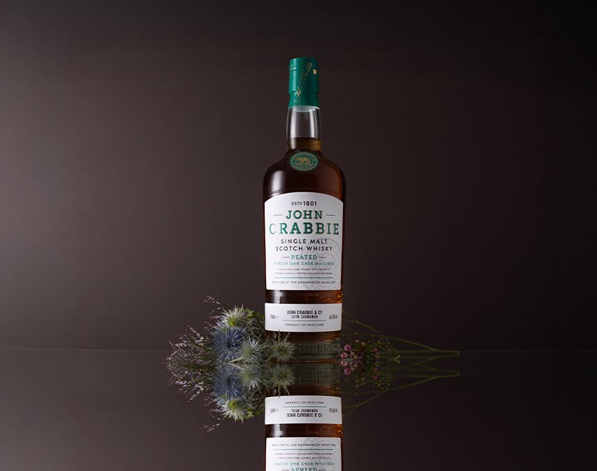 A bottle of John Crabbie Single Malt Peated Virgin Oak.