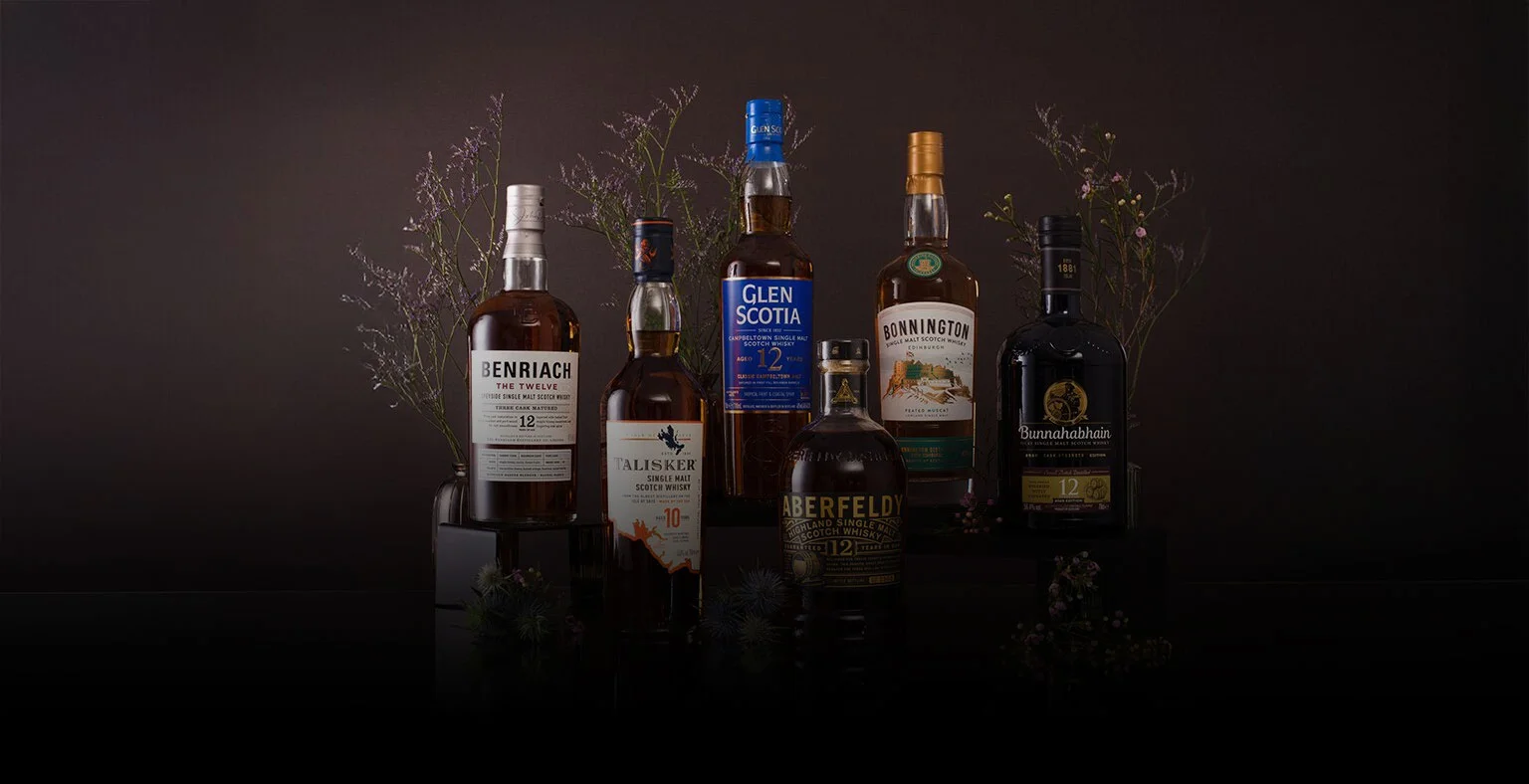 Six bottles of Scotch whisky: Talisker, Aberfeldy, Bonnington, Glen Scotia, Benriach, and Bunnahabhain.