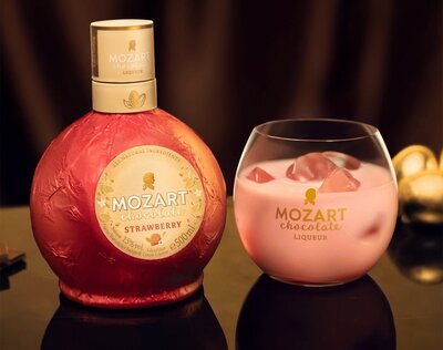 A bottle of Mozart White Chocolate Strawberry Cream Liqueur.