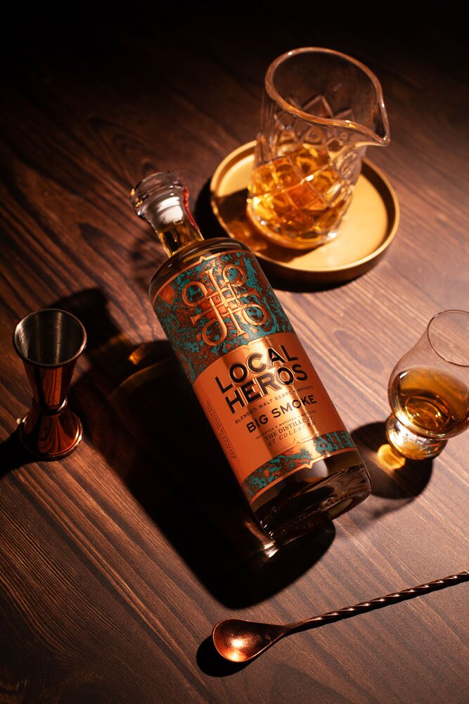 Local Heros Big Smoke whisky bottle with glass and barware