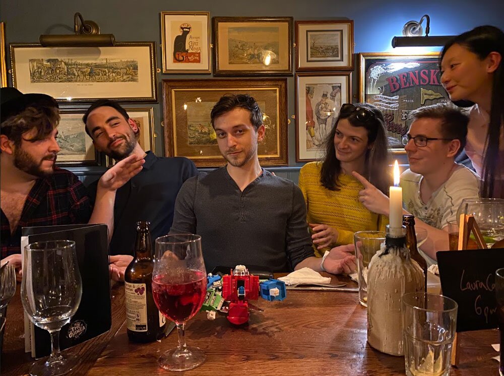 MoM team pointing to Sam from IT in the pub