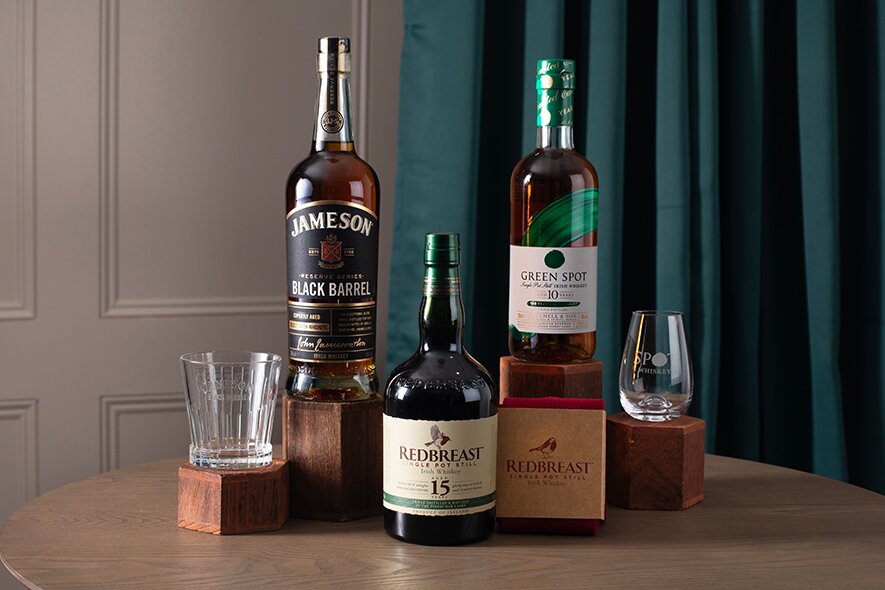 A bottle of Redbreast 15, Jamesons Black Barrel and Green Spot whiskey.