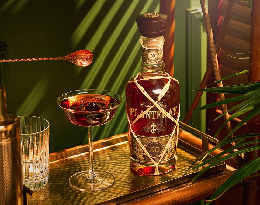 A bottle of Planteray XO Barbados 20th Anniversary and cocktail
