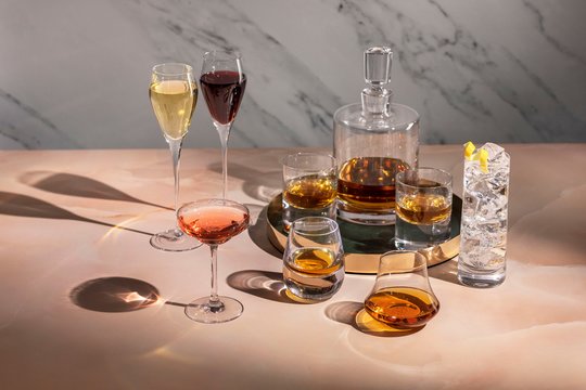 A collection of glassware with various drinks.