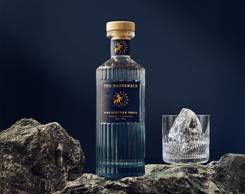 A bottle of The Sassenach Fine Scottish Vodka on rocks. 