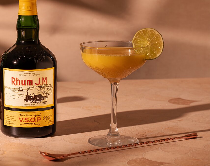A bottle of Rhum J.M VSOP with a Passionfruit & Lychee Daiquiri.